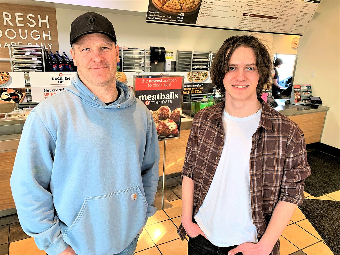 Jackson Staples, right, and Gary Dixon stand at the Papa Murphy's on Government Way in Coeur d'Alene where Dixon lost an envelope with $1,200 last Friday. Jackson found it and the money was returned to Dixon.