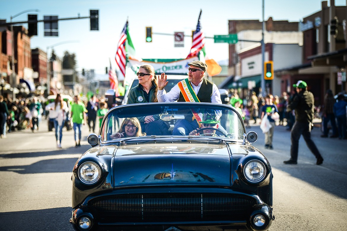 Members of the parade procession make their way down Main Street during the St. Patrick's Day Parade in Kalispell on Friday, March 17. (Casey Kreider/Daily Inter Lake)