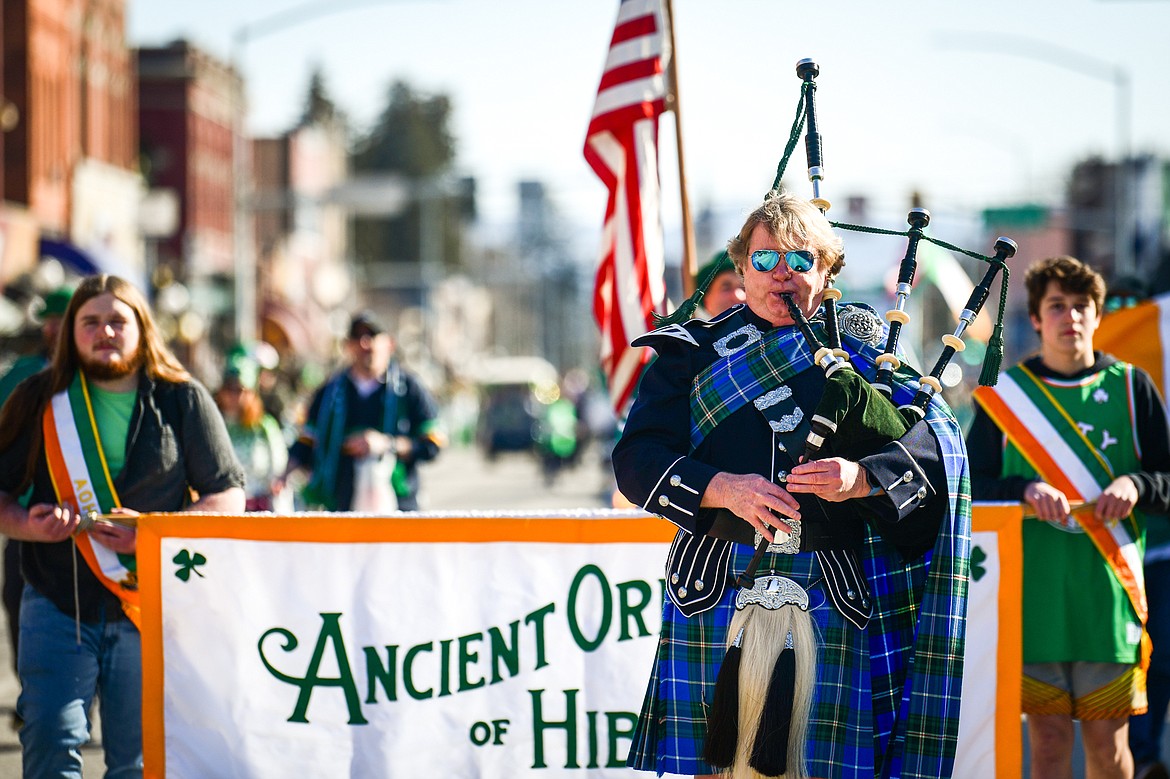 Michael Gilbert, the Montana Bagpiper, leads the procession in front of the Kalispell Chapter of the Ancient Order of Hibernians during the St. Patrick's Day Parade in Kalispell on Friday, March 17. (Casey Kreider/Daily Inter Lake)