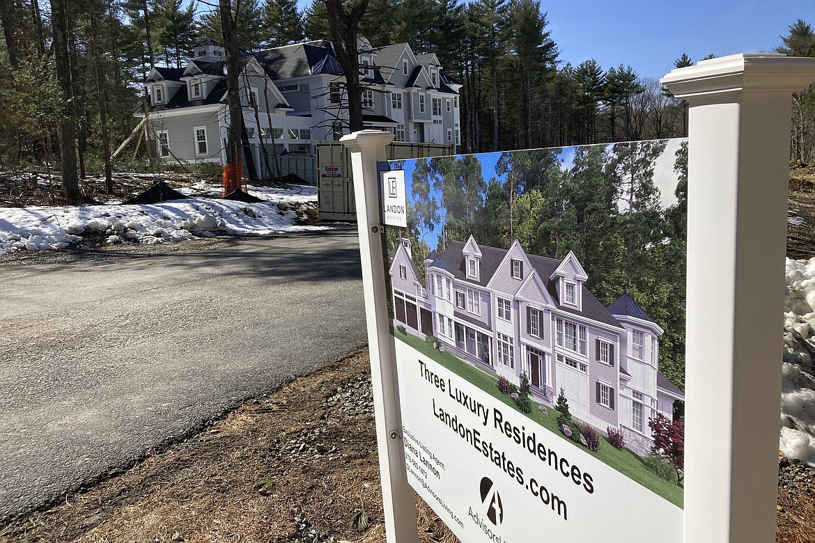 A sign announces newly built homes at a development in Sudbury, Ma., on Sunday, March 12, 2023. On Thursday, Freddie Mac reports on this week's average U.S. mortgage rates. (AP Photo/Peter Morgan)