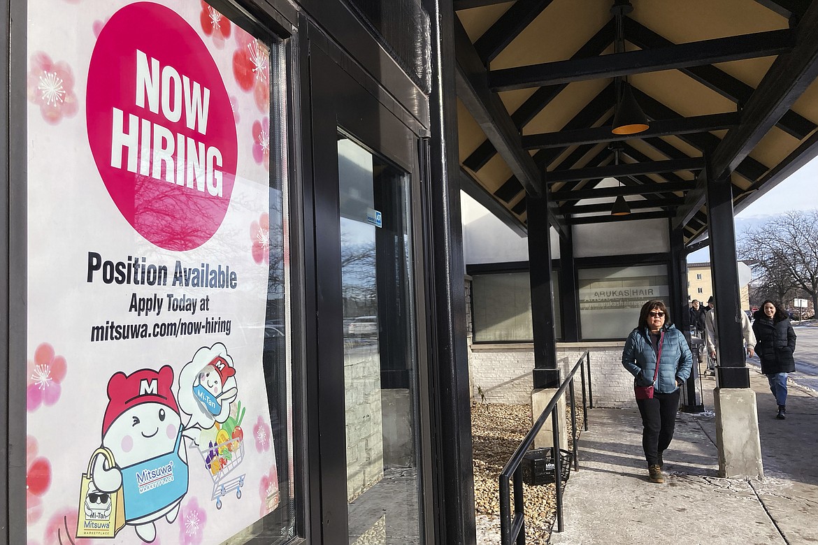 File - A hiring sign is displayed at a grocery store in Arlington Heights, Ill., Tuesday, Dec. 27, 2022. On Thursday, the Labor Department reports on the number of people who applied for unemployment benefits last week. (AP Photo/Nam Y. Huh, File)