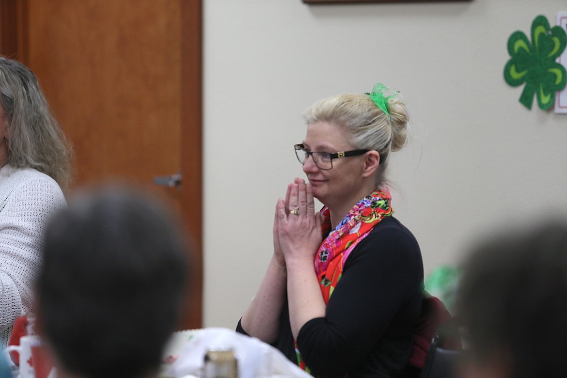 Dana Bellefeuille, owner of the Village Bakery in Hayden, listens as she is about to be presented an award Friday morning during a meeting of the Daughters of the American Revolution Lt. George Farragut Chapter.