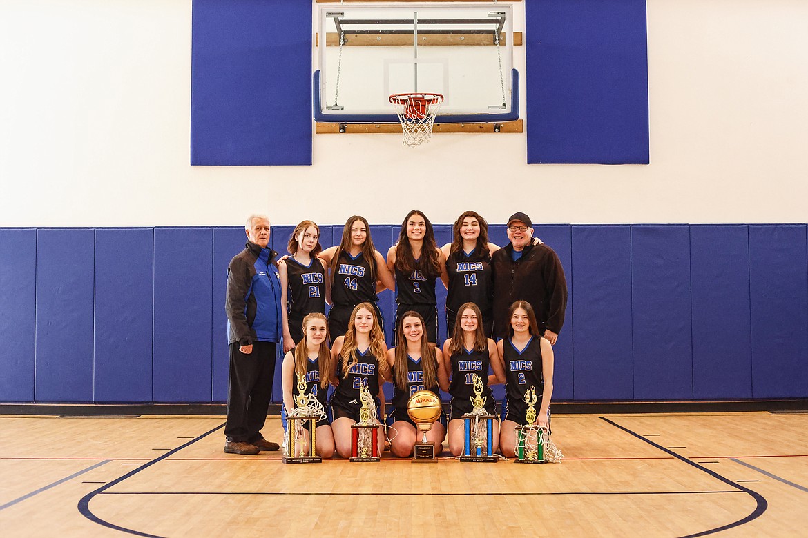 Courtesy photo
The North Idaho Christian School girls basketball team poses with the golden ball for winning the regular season and with trophies for winning three tournaments. The Royals finished 31-2, with 31 wins being the most in the school's 36 year history. In the front row from left are Madison Salaiz, Belle Sanwald, Symone Pilgrim, Danica Kelly and Jennifer Peterson; and back row from left, coach Jerry Bittner, Mae Overall, Yesi Pilgrim, Chelsey Cate, Rylee Overturf and coach Ryan Overturf.