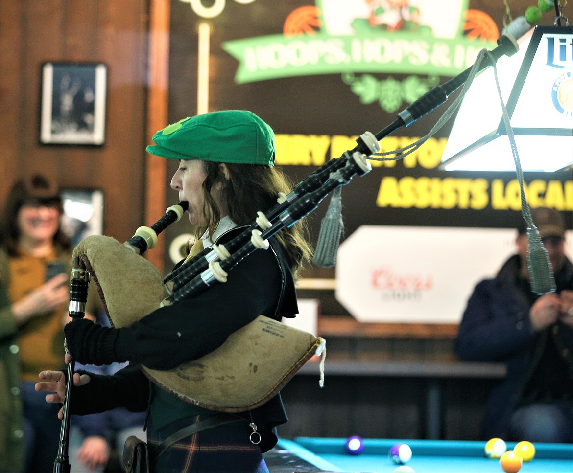 Kristin Stafford plays the bagpipes at Paddy's Sports Bar on Friday.