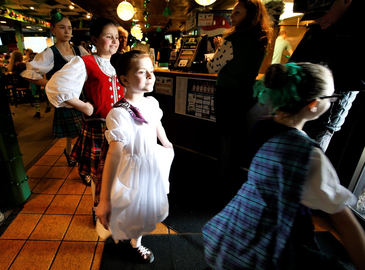 Members of Lake City Highland Dance file out of Paddy's Sports Bar after performing on St. Patrick's Day.