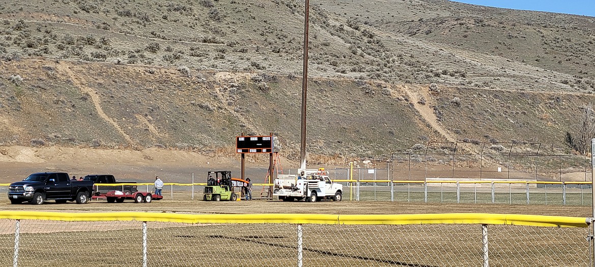 Workers setting up the new scoreboard in Lions Park in Ephrata Friday morning.