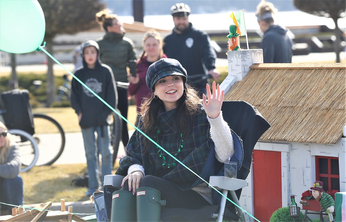 Karlynn King, Irish Colleen of the St. Patrick's Day Parade in Coeur d'Alene, waves to the crowd.