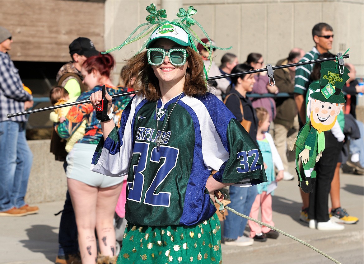 Chylor Lance with North Idaho Jeeps enjoys the St. Patrick's Day Parade in Coeur d'Alene on Saturday.