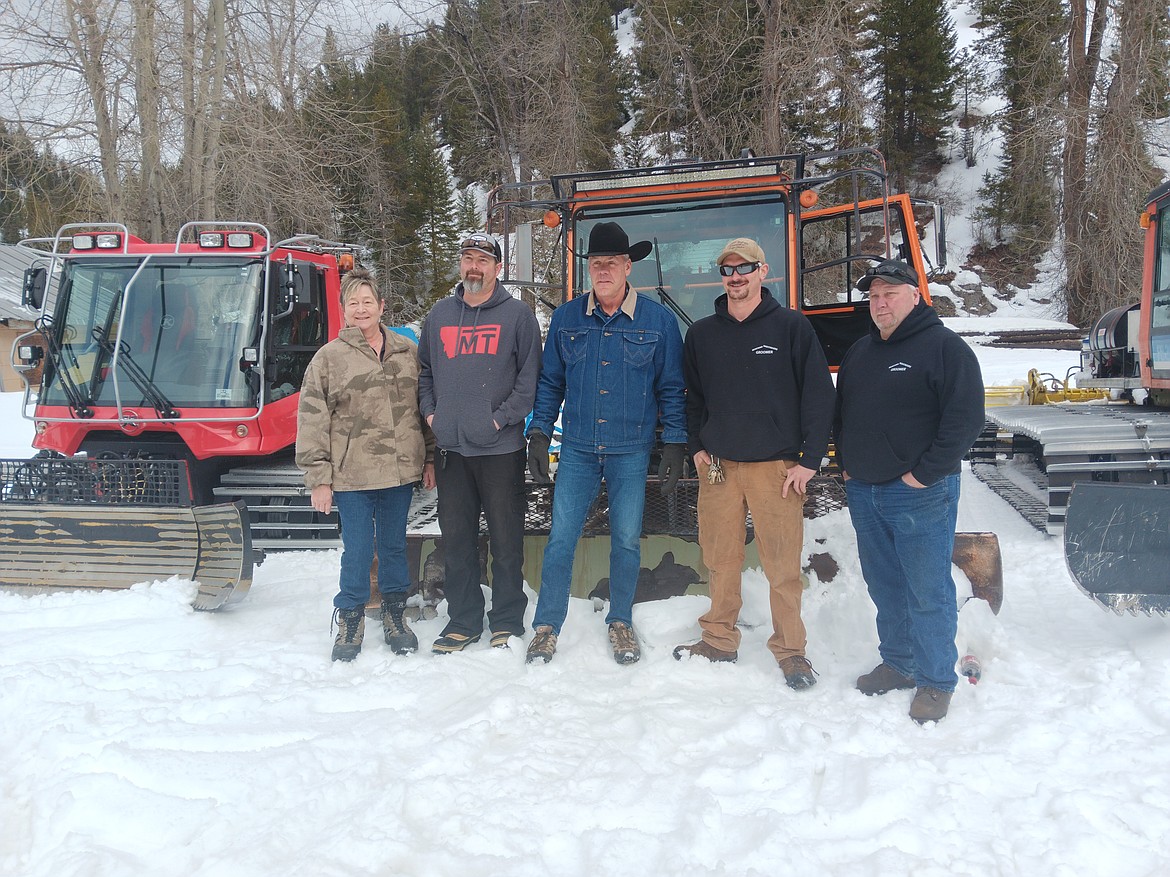 Brooke Lincoln, Jake Downing, U.S. Rep. Ryan Zinke, Brennan Teeters and Ted Groshong stand in front of the three grooming machines the Montana Nightriders Snowmobile Club uses to groom 125 miles for public snowmobiling. Zinke visited with the organization about the Saltese Trestle and how he might be able to help finish the project with them. (Monte Turner/Mineral Independent)