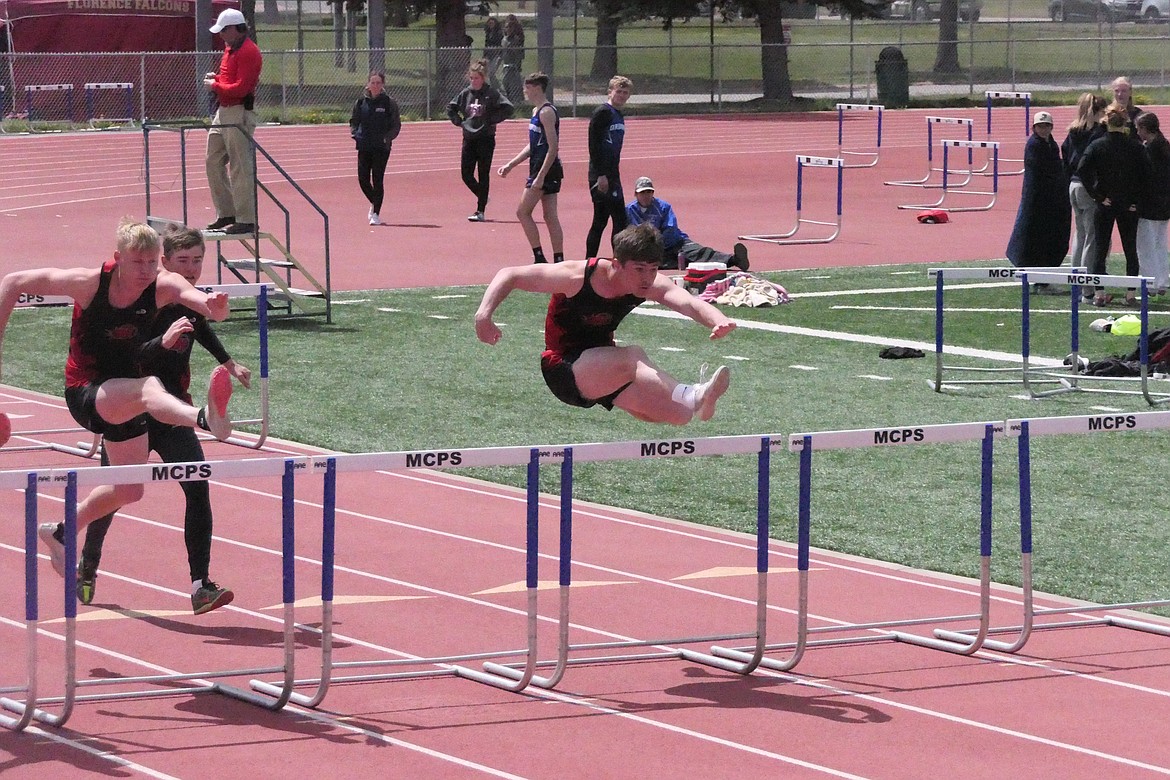 Graduated Hot Springs hurdler Kyle Lawson (far right) who is now a student/athlete at Western Montana, clears the hurdles ahead of teammate Quincy Styles-Depoe during last year's Divisional track and field tournament in Missoula. Styles-Depoe is back as a junior this year, competing in several events for the Savage Heat. (Chuck Bandel/VP-MI)