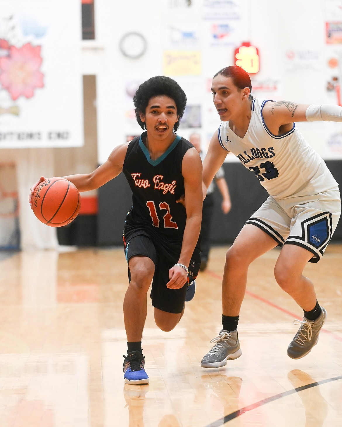 Malacye Piatpot (Two Eagle) races down the floor, flanked by Landon Walks Over Ice (Mission) during the Mission Valley All Star game last Tuesday in Ronan. (Christa Umphrey photo)