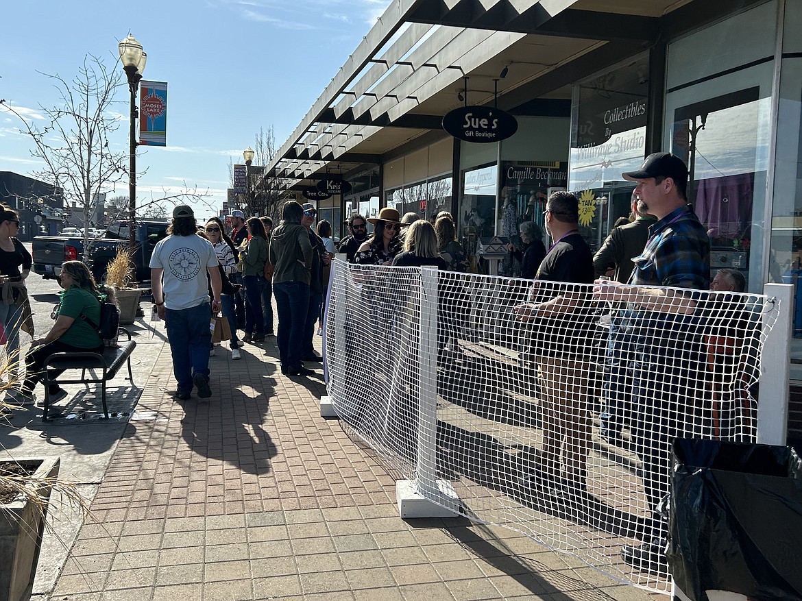 The sunny day made for a great turnout at the 2023 Brews and Tunes event. Many people chatted outside participating businesses as they waited to go in.