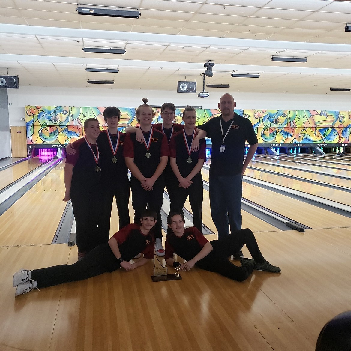 Courtesy photo
The Post Falls High School boys took first place in 5A at the recent state bowling championships in Garden City. In the front from left are Alex Higgins and Donald Shaw, and back row from left, Alex Walker, Eric Campbell, Bladen Huffaker, Quinlan Campenella, Jayson Austin and Bryan Rider (coach).