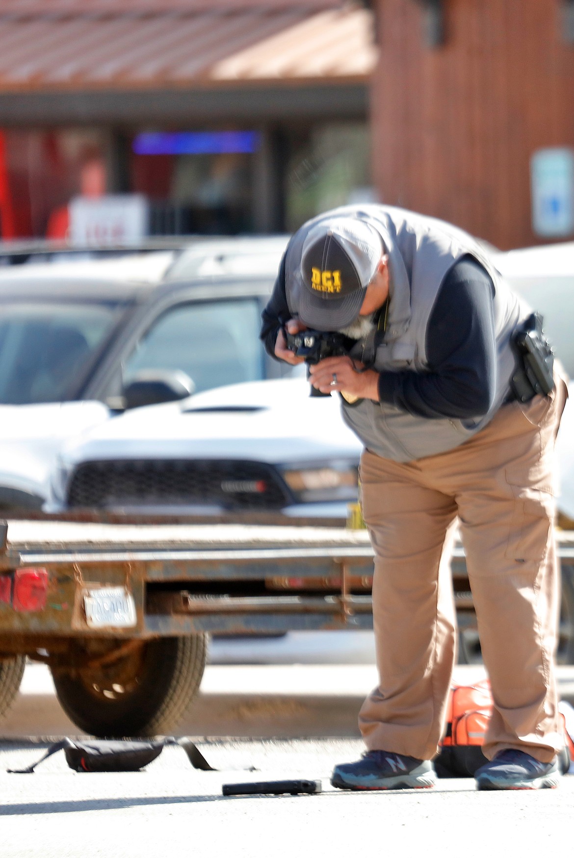 Evidence is collected from the scene of a shooting at St. Regis on Saturday. (Jessica Peterson photo)