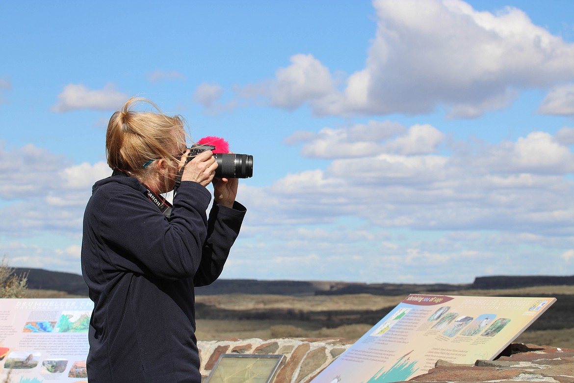 Cindy Nunez of Tacoma photographs the scenery during a previous Othello Sandhill Crane Festival.