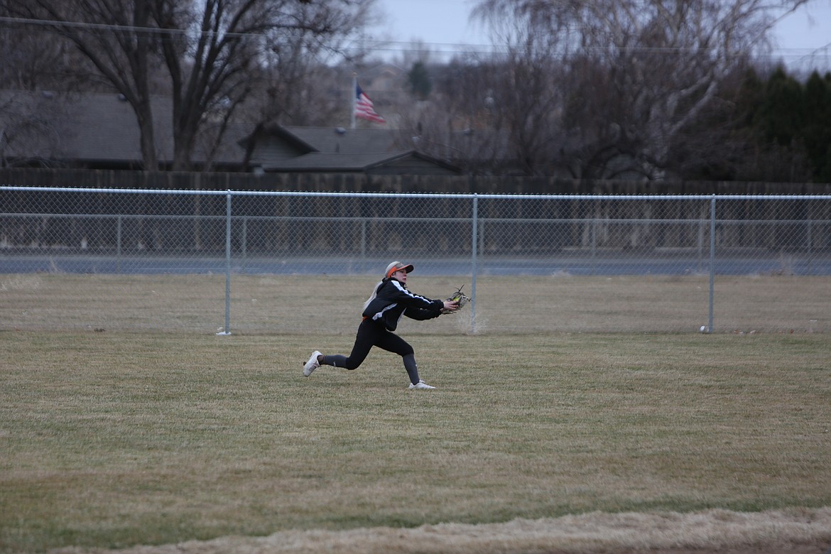 Ephrata sophomore Maya Van Velkinburgh stretches out to catch a fly ball in the outfield.