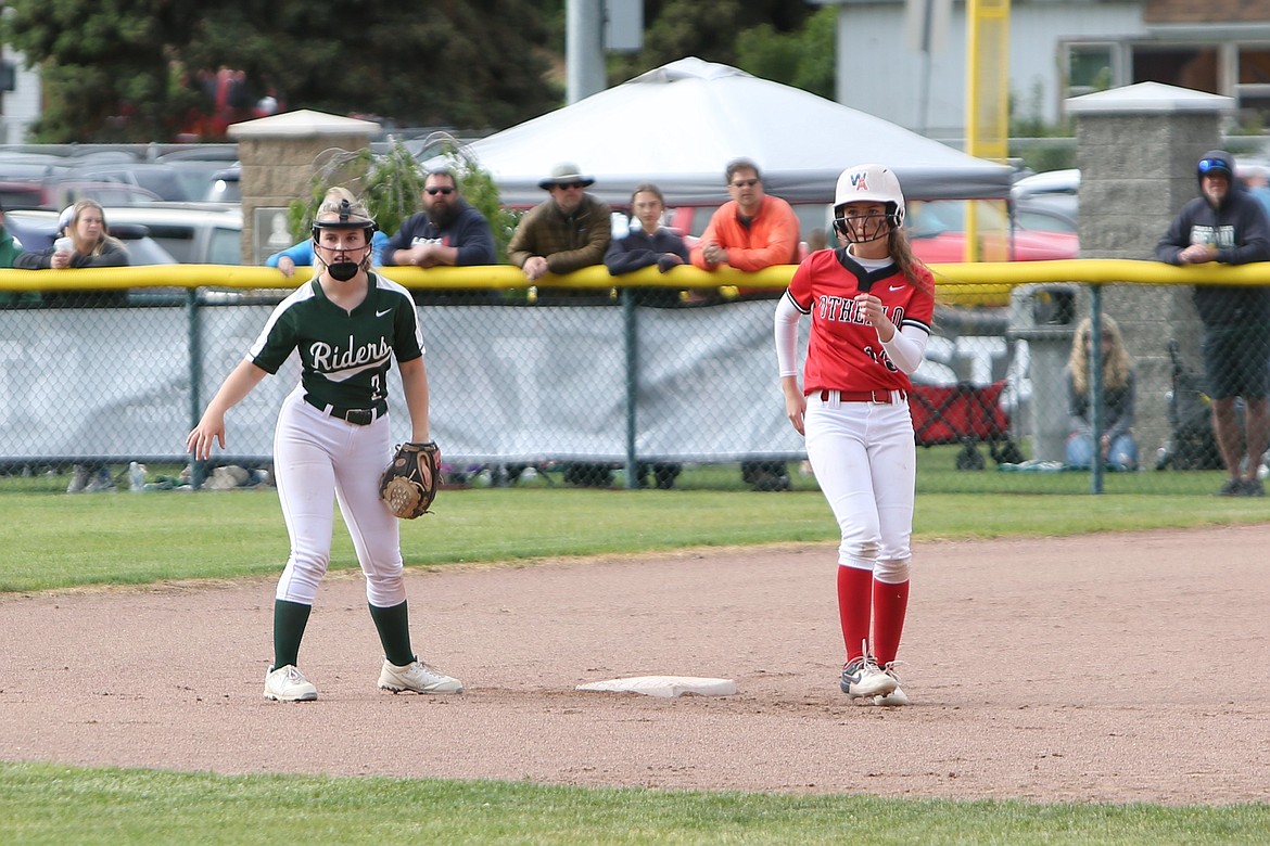 Othello senior Camryn McDonald, right, stands on second base during the Huskies’ state quarterfinals matchup against Port Angeles last season.