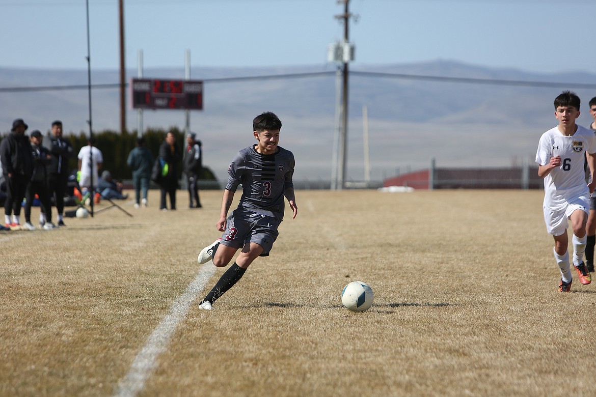 Wahluke senior Luis Garcia (3) moves the ball upfield against the Wapato defense.