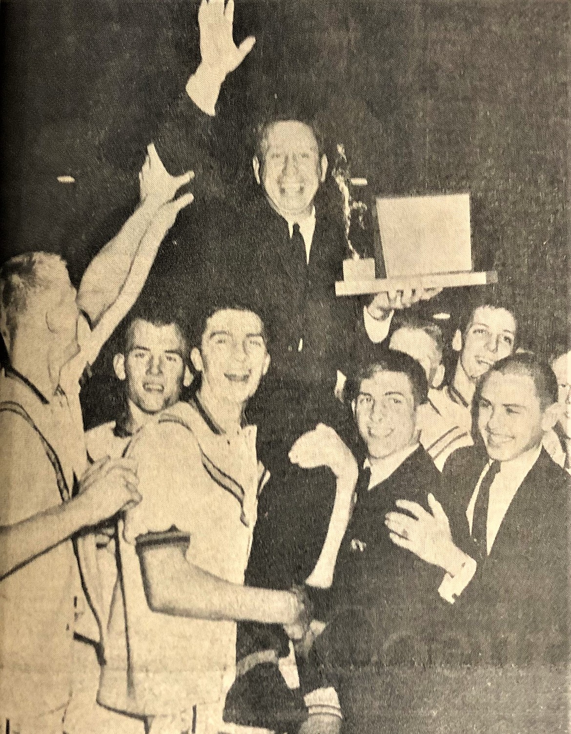Coach Elmer Jordan and Vik players celebrate 1963 state title.