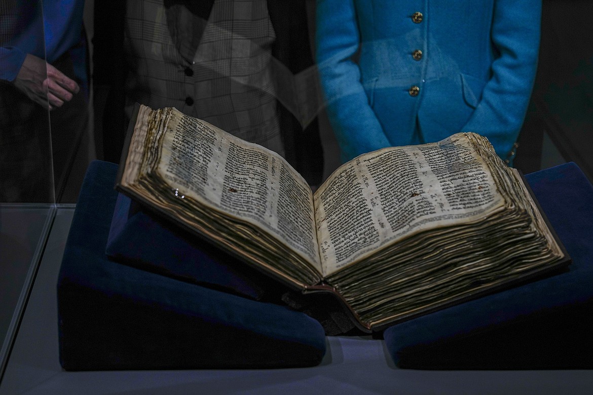 The Codex Sassoon 1,100-year-old Hebrew Bible is on display at the Tel Aviv's ANU Museum of the Jewish People for a week-long exhibition of the manuscript, part of a whirlwind worldwide tour of the artifact in the United Kingdom, Israel and the United States before its expected sale, Israel, Wednesday, March 22, 2023. One of the oldest surviving biblical manuscripts is up for sale — for a cool $30 million. The Codex Sassoon is a nearly complete 1,100-year-old Hebrew Bible. Sotheby's is putting it up for auction in New York in May for an estimated price of $30 million to $50 million. (AP Photo/Ariel Schalit)