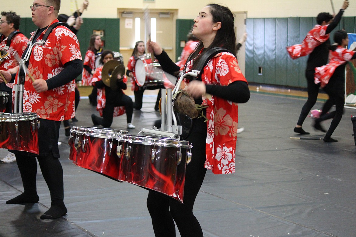 OTHELLO — Othello High School junior Rachel Bates practices with the OHS drumline Tuesday prior to the group’s regional competition Saturday in Portland. 
The drumline’s entry into the Winter Guard International competition is titled “Eruption” and tells the story of ancient tropical legends.