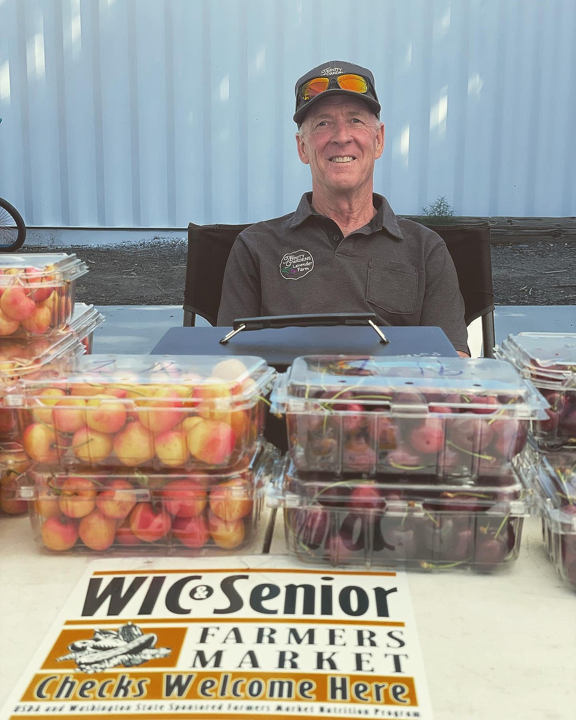 A vendor sells cherries at the B Street Market in July 2022. Market managers are looking for people and support to keep the market going.