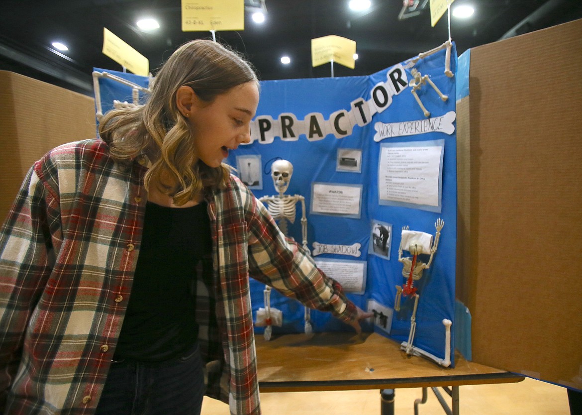 Future chiropractor Eden Hardison of Post Falls High shows on her display board the different tools chiropractors use as they work with patients.