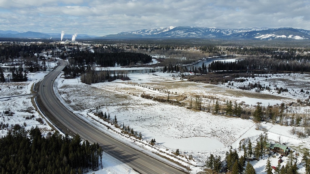 An aerial view of Location Ventures' proposed subdivision looking west into Columbia Falls. If the project is approved, it would be located in the parcel just to the north of U.S. 2. (JP Edge/Hungry Horse News)