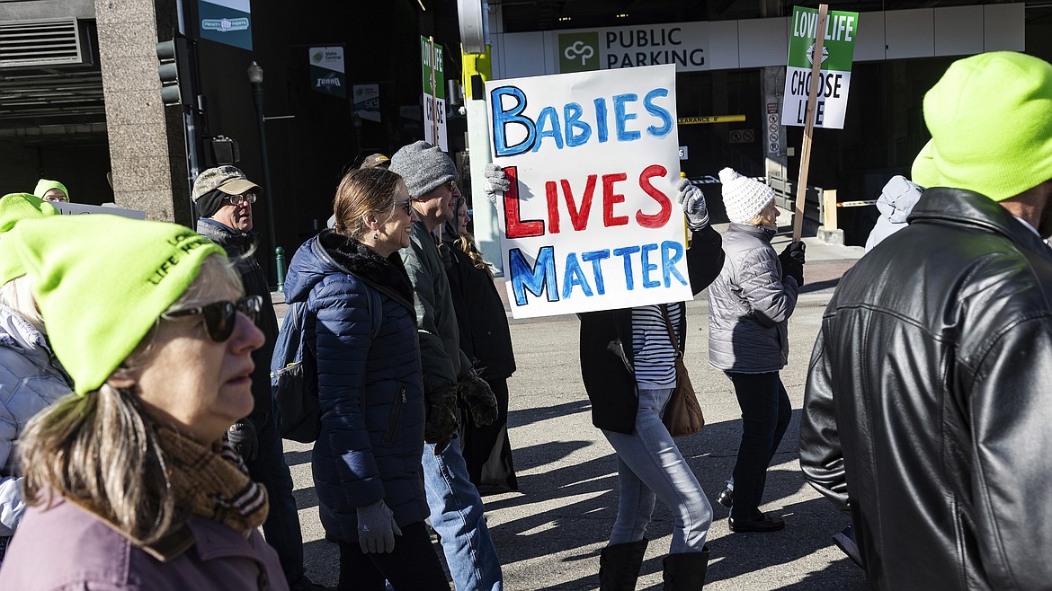 People walk to the Idaho Capitol Building for the Boise March for Life rally, Saturday, Jan. 21, 2023. A rural hospital in Sandpoint, Idaho, will stop delivering babies, citing recently passed state laws criminalizing medical care, among other reasons. (Sarah A. Miller/Idaho Statesman via AP,File)