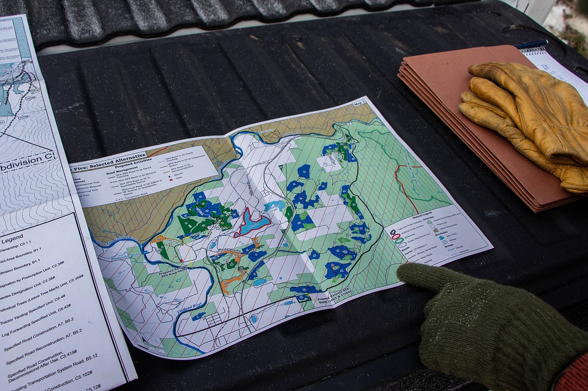 Paul Donnellon, a supervisory forester with the Flathead National Forest, points to a map of the Lake Five operation on March 9, 2023 just outside of Coram. (Kate Heston/Daily Inter Lake)