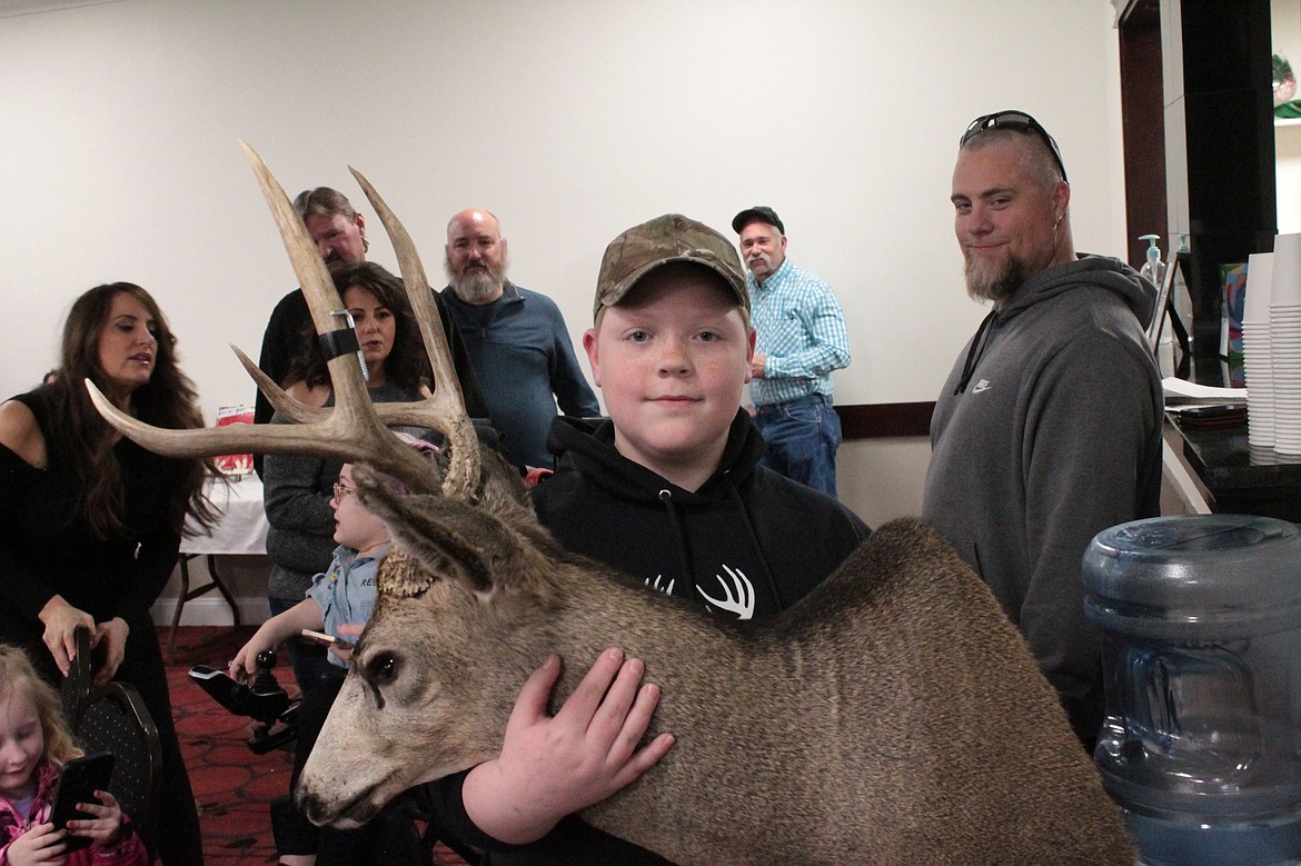 Aiden Wilsey displays the trophy head of the buck he harvested last year with Youth Outdoors Unlimited.