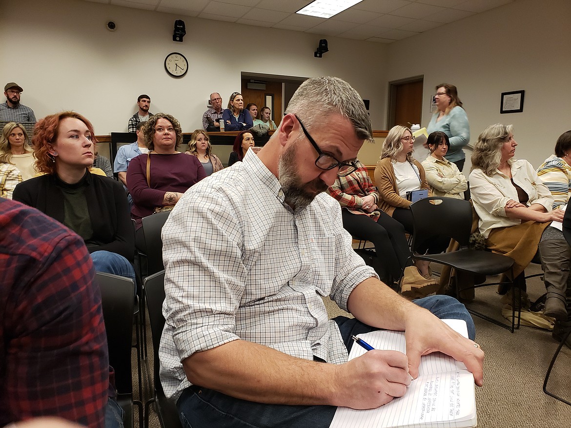 In an appeal to the Hayden City Council, Jeramie Terzulli takes notes during public comment in preparation for his rebuttal. Terzulli presented arguments in the hopes of changing the council's decision not to allow a subdivision of 25 new homes at the corner of Ramsey Road and Dakota Avenue.