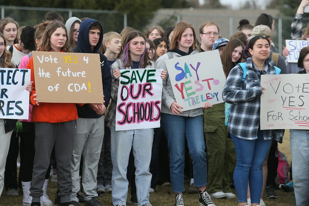 Students hold signs as they gather for a peaceful rally Friday at Lake City High School in response to people voting against the supplemental levy, which funds 25% of the Coeur d'Alene School District's budget. Students are urging community members to vote "yes" May 16 when the levy measure will again go before voters.