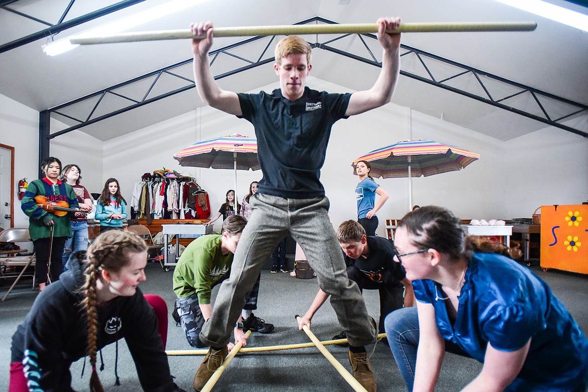 Jarom Holcomb as Caractacus Potts, center, and fellow castmates peform a scene as the Homeschool Theater Club practices their performance of Chitty Chitty Bang Bang on Friday, March 24. (Casey Kreider/Daily Inter Lake)