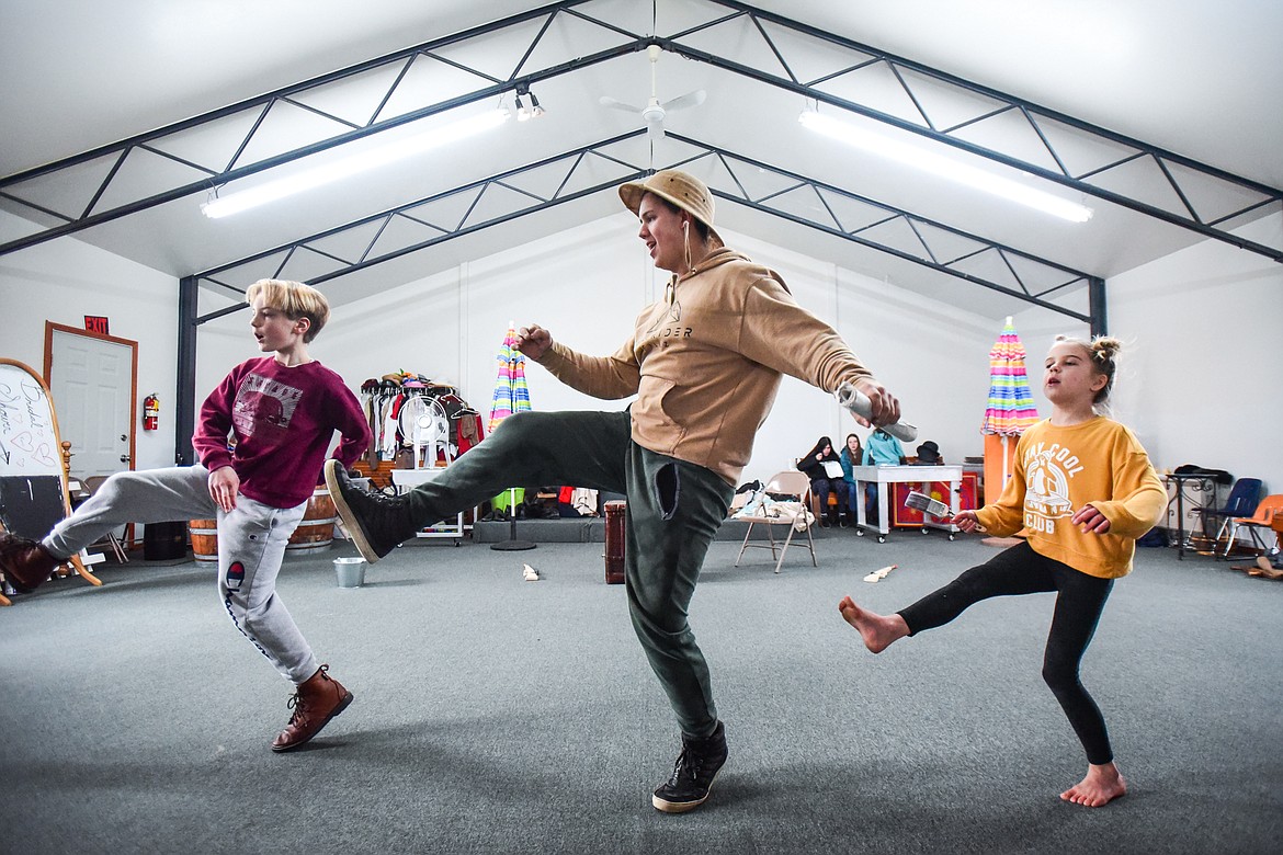 From left, Kaiden Reed as Jeremy, Eric Sullivan as Grandpa and Skylar McGaughy as Jemima  as the Homeschool Theater Club practices their performance of Chitty Chitty Bang Bang on Friday, March 24. (Casey Kreider/Daily Inter Lake)