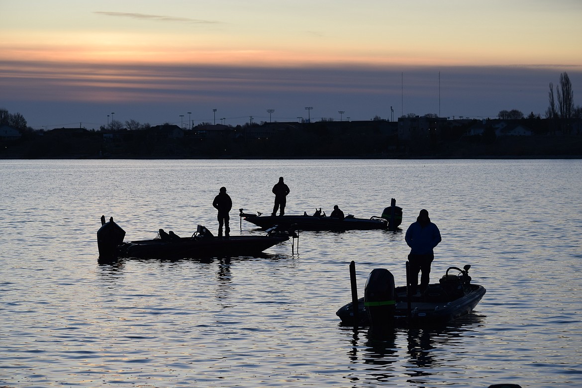 Three boats wait for the start of the Idaho-based Panhandle Bass Anglers fishing tournament on Moses Lake early Saturday morning.