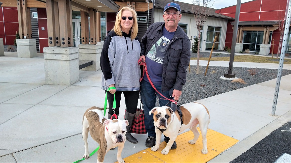 Dennis and Dawn Wright adopted Lola, left, as a playmate for their dog, at Companions Animal Center on Saturday. Photo by Vicky Nelson/CAC