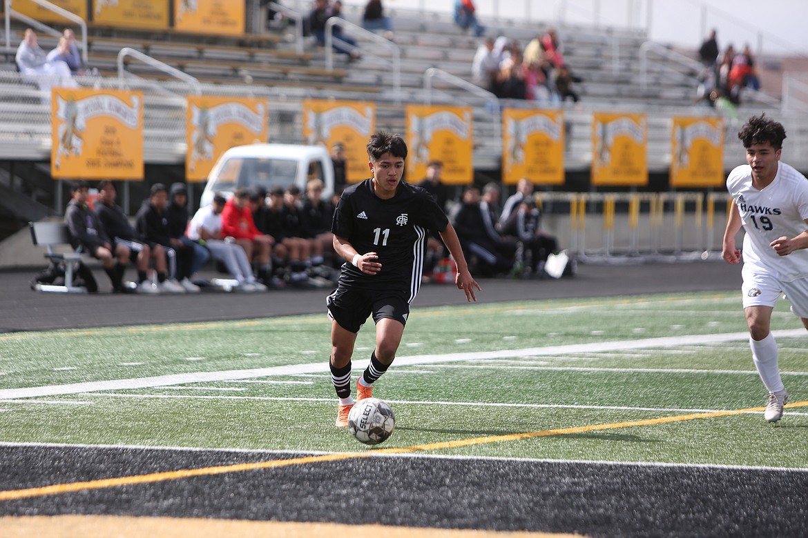 Royal junior Freddy Cabrera goes on the attack during the first half against College Place on Saturday.