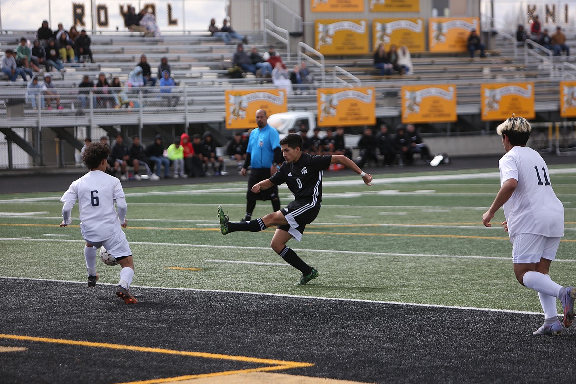 Royal senior Silverio Hernandez shoots the ball for a goal against College Place. Hernandez finished with a hat trick.