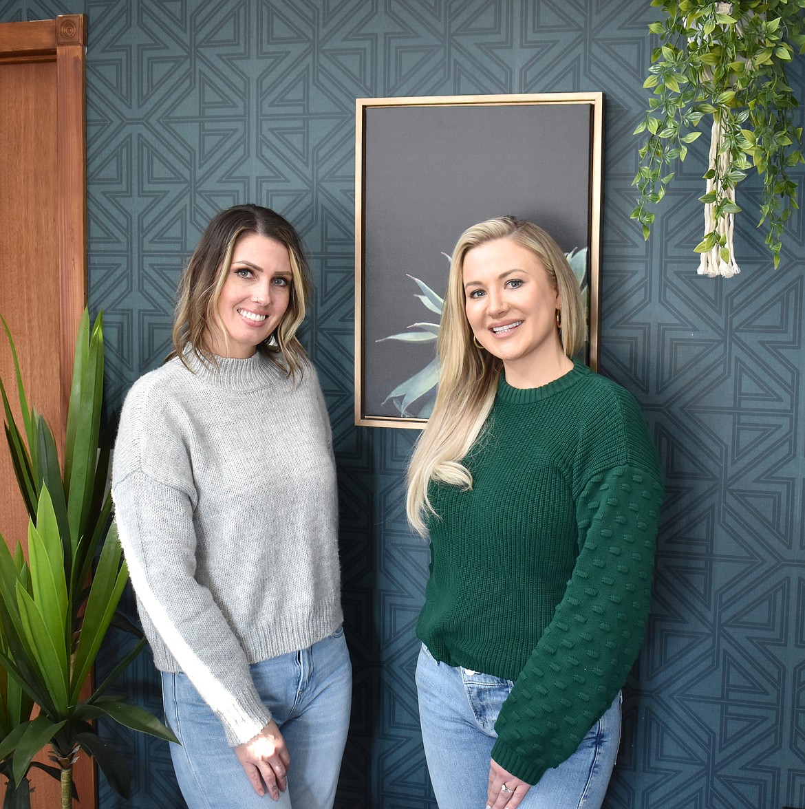 Danielle Palmer, left, and Anna Van Diest of Basin Ag Sales pose at their office. Palmer coordinates paperwork and showings and keeps things running smoothly, Van Diest said.