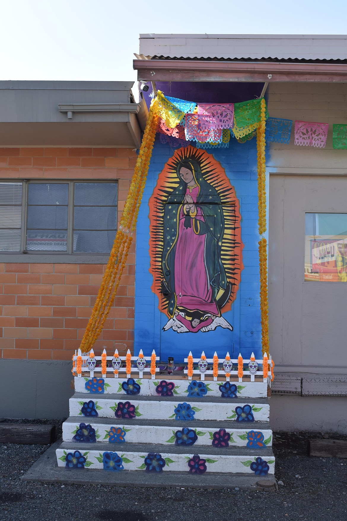 Paul Carney, owner of EDUBS C/S at 1102 W. Broadway Ave., painted this shrine to the Virgin of Guadalupe, on this side of his business, prior to the Day of the Dead in 2022, giving residents a place to say a prayer and honor their ancestors. “It was nice to do something for the community,” he said.