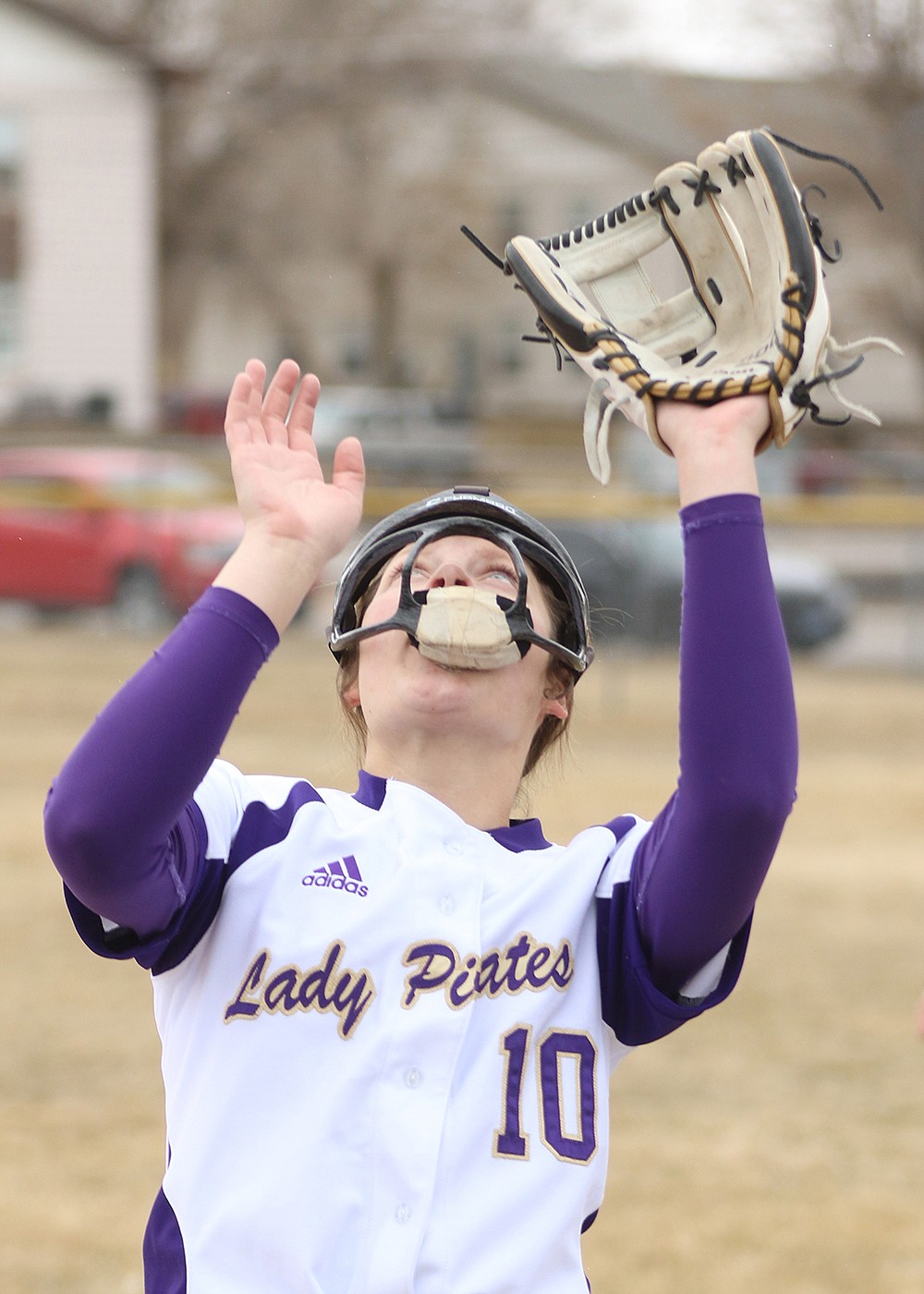 McKenna Hanson prepares to catch a pop-up during a March double-header in Polson. (Bob Gunderson photo)