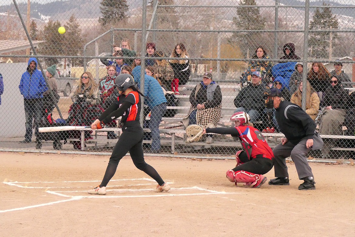 Plains shortstop Carlie Wagoner connects for the Trotters' first hit of the season during a game against Columbia Falls Saturday in Polson.  Wagoner also scored the team's first run of the season two batters later.  (Chuck Bandel/VP-MI)