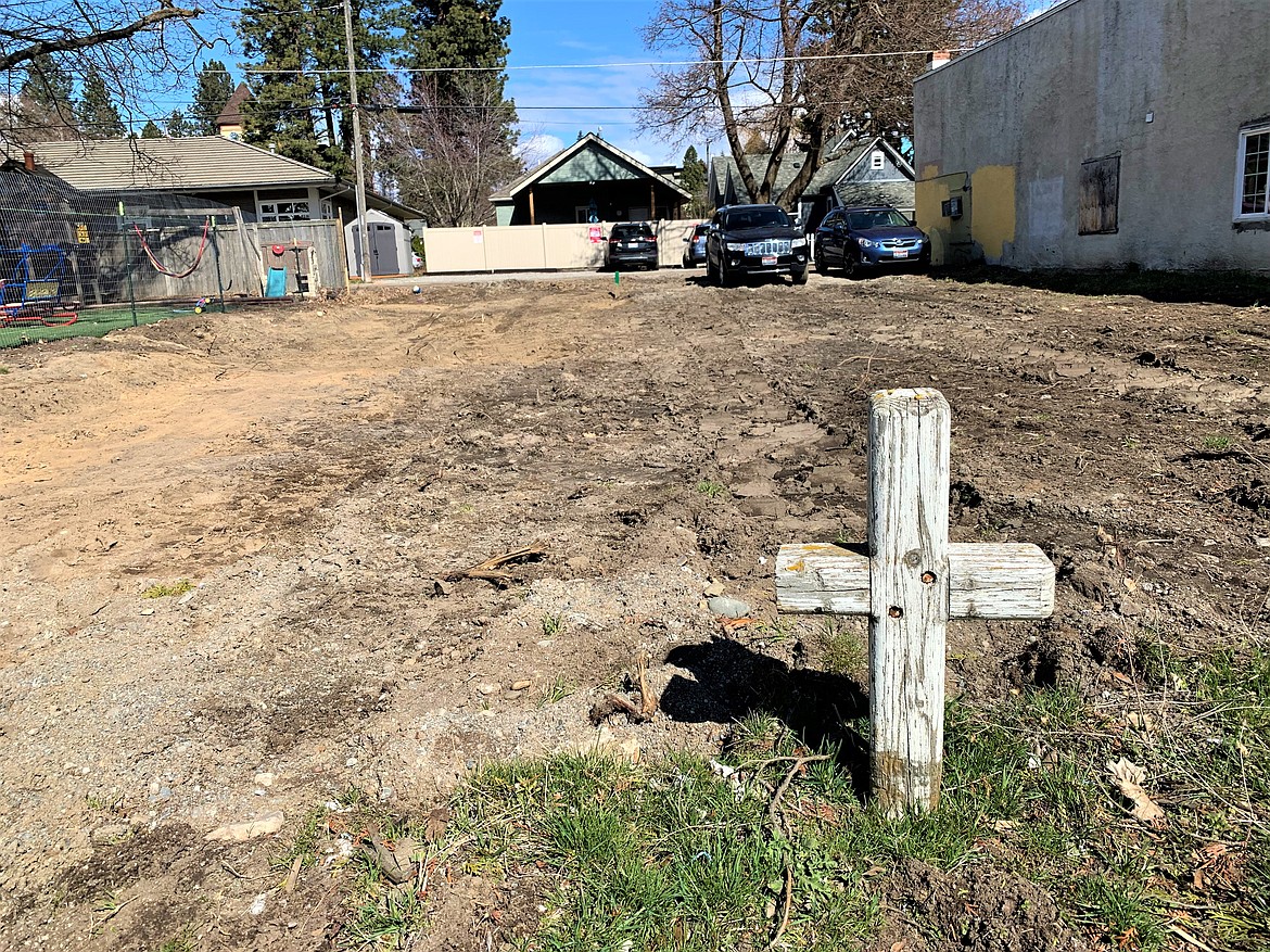 A cross stands in the yard at 113 E. Indiana Ave., where a home built in 1885 was recently demolished after falling into disrepair.