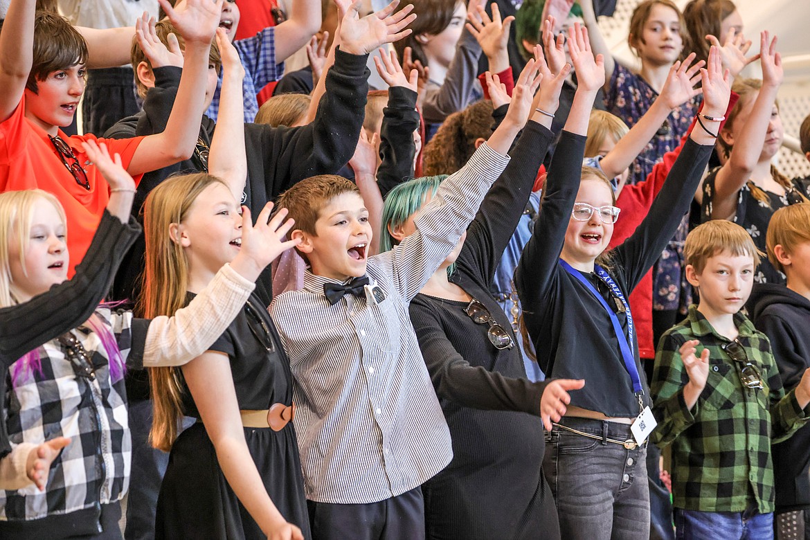 Fifth graders at Glacier Gateway wave to their parents in the crowd at last week’s Jazz Program. (JP Edge photo)