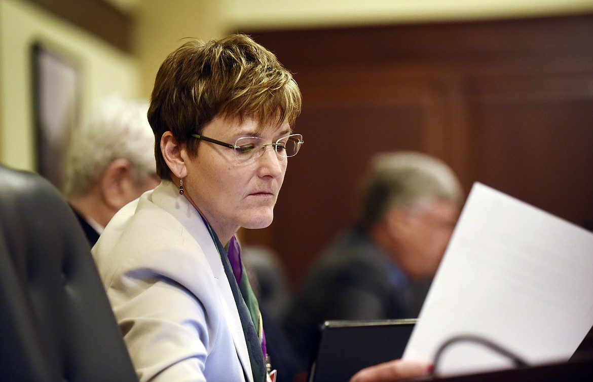 Democratic Rep. Melissa Wintrow, of Boise, looks at a paper before presenting legislation at the House Judiciary, Rules and Administration Committee meeting in the House Hearing Room in the Idaho Statehouse, Feb. 15, 2016. On Monday, March 27, 2023, the Idaho Senate voted 22-12 to pass a bill criminalizing gender-affirming healthcare for minors, one month after the state House passed similar legislation. Before the vote, Wintrow read a letter from a constituent pleading with lawmakers to reject the bill. (Greg Kreller/The Idaho Press-Tribune via AP, File)