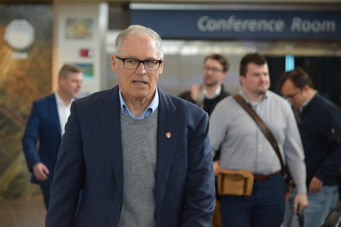 Gov. Jay Inslee walking through the terminal of the Grant County International Airport on Tuesday during a visit to meet local high-tech business leaders in Moses Lake.