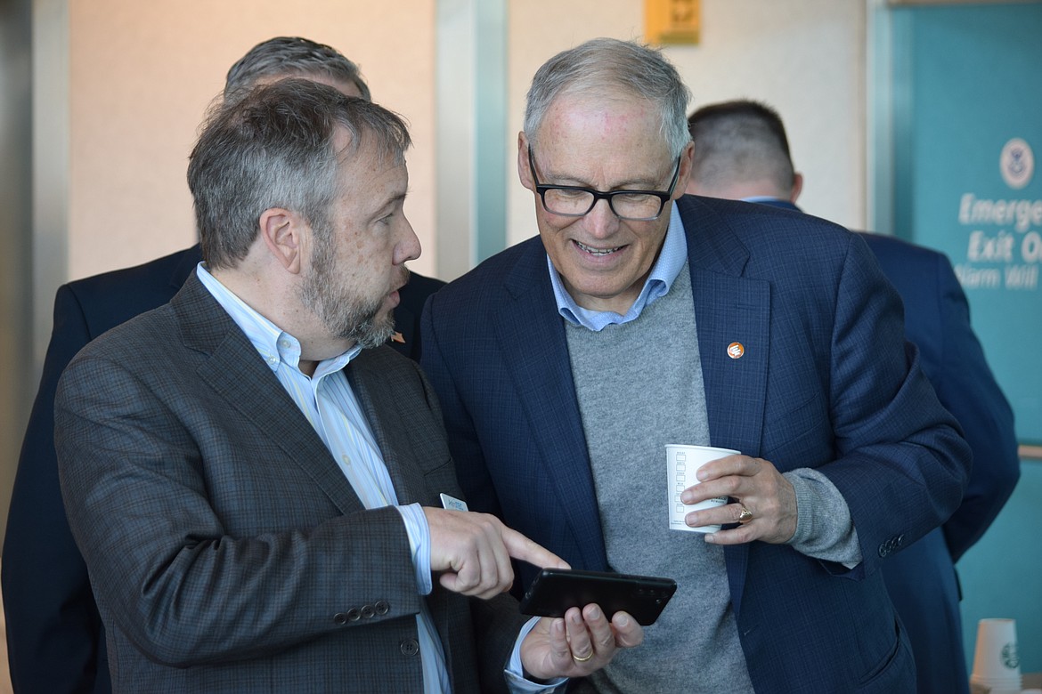 AeroTEC CEO and President Lee Human talking with Gov. Jay Inslee on Tuesday.