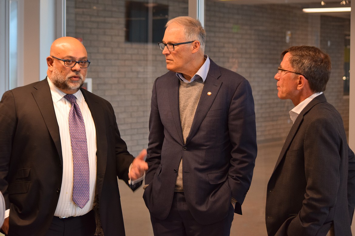 Sila Nanotechnologies Chief Financial Officer Warren DeSouza, Gov. Jay Inslee and Group 14 Technologies CEO Rick Luebbe talk after a roundtable on advanced battery technology at Big Bend Community College during Inslee’s visit to Moses Lake on Tuesday.