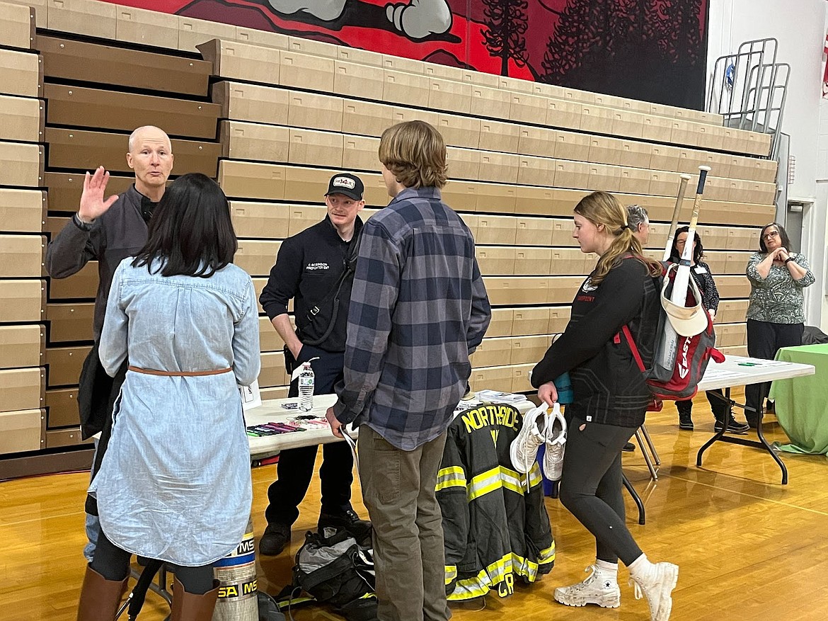 Northside Fire officials talk to students at the recent Next Steps Night. The inaugural event attracted representatives from 15 colleges, 25 businesses, and six military groups.